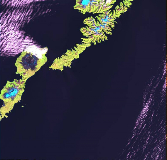 Landsat 7 ETM+ image, with Unalaska Island (Makushin Volcano) on right, and Umnak Island (Okmok, Vsevidof, and Recheschnoi volcanoes) on left.