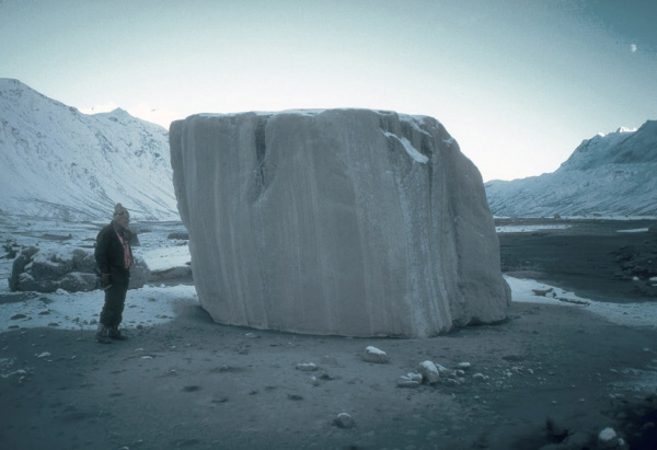 Geologist Don Richter stands beside one of the large blocks of glacial ice that were carried many 
kilometers downstream by lahars during the 1989 to 1990 
eruptions of Redoubt Volcano. Photograph by T. Miller, U.S. 
Geological Survey, January 5, 1990.