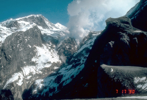 The final lava dome of the 1989 to 1990 series of 
eruptions of Redoubt Volcano was emplaced in the summit 
crater by summer, 1990. It measures approximately 350 to 
400 m (980 to 1,300 ft) across and represents an estimated 
10 million cubic meters (353 million cubic feet) of 
material. Photograph by C. Neal, U.S. Geological Survey, 
July 17, 1990.