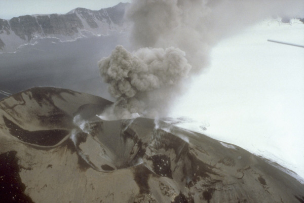 A burst of gray ash rising from the intracaldera cinder cone at Veniaminof volcano on the Alaska Peninsula. Photograph by D. Sellers, Alaska Department of Fish and Game,
August 3, 1993.