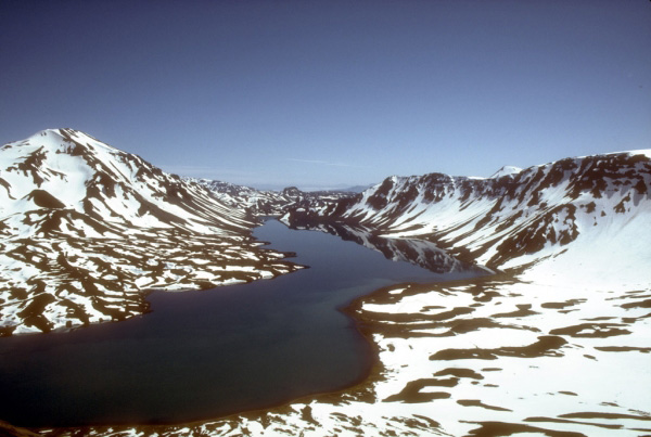 View, looking southeast, of a portion of the Emmons Lake caldera on the Alaska Peninsula.  The most recent of several caldera-forming eruptions at Emmons Lake occurred more than 10,000 years ago. No historical eruptions have occurred at Emmons Lake. Photograph by T. Miller, U.S. Geological Survey, July, 1987.