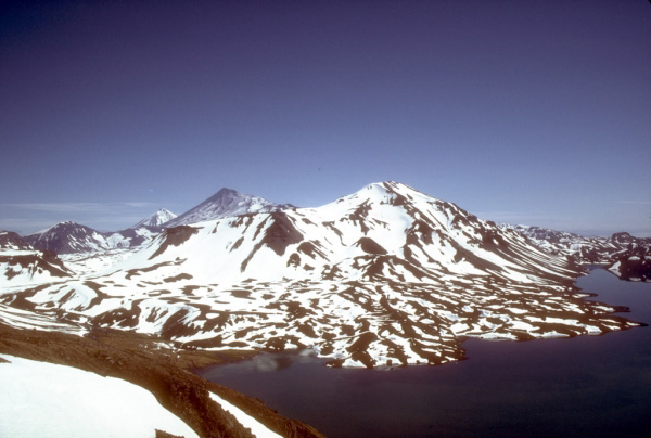 View, looking northeast, of 1,436-m (4,711 ft)-high Mount Emmons, a postcaldera stratovolcano within the Emmons Lake caldera on the Alaska Peninsula. The most recent of several caldera-forming eruptions at Emmons Lake occurred more than 10,000 years ago.  No historical eruptions have occurred at Emmons Lake. Photograph by T. Miller, U.S. Geological Survey, July, 1987.