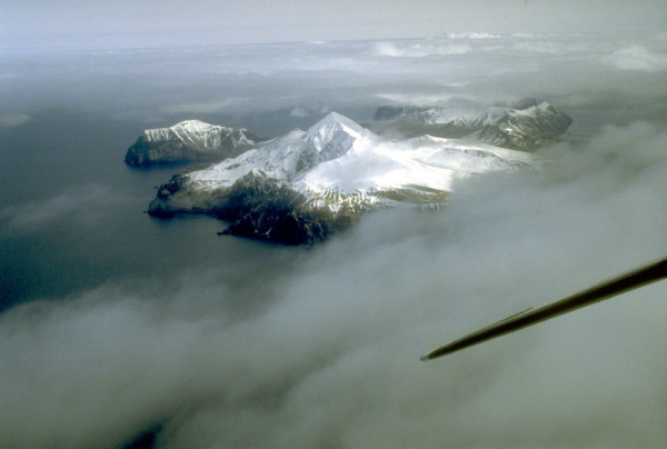 Mount Gilbert is a poorly known 818-m-high (2,684 ft) volcano which forms the north part of Akun Island in the eastern Aleutian Islands. Active fumaroles were documented 1.5 km (1 mi) northeast of the summit in the early 1900's. Photograph by C. Nye, Alaska Division of Geological and Geophysical Surveys, May 10, 1994.