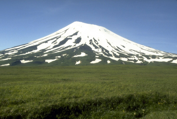 View, looking north, of symmetrical Vsevidof volcano, a historically active, 2149-m (7,050 ft)-high stratovolcano on central Umnak Island in the eastern Aleutian Islands. Photograph by C. Nye, Alaska Division of Geological and Geophysical Surveys, August, 1985.