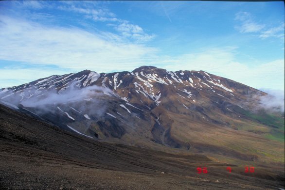 East flank of Akutan Volcano.  Top of intracaldera cinder cone is visible in center.