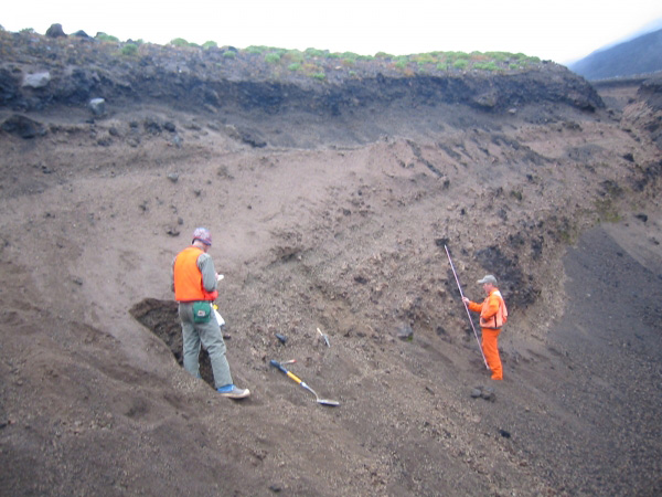 Brandon Browne and Game McGimsey measuring section 03GRBB16 on south flank of Gareloi Volcano. Section comprises fall deposits from 1929 eruption of Gareloi. 