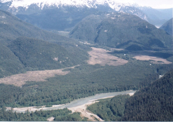 View of lava flow spread out in the Unuk River Canyon, damming the canyon. The river then cut through, making the "first rapids" on the Unuk River.