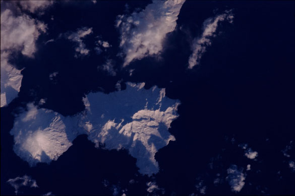 Mission: ISS001 Roll: 342 Frame: 25 Mission ID on the Film or image: ISS01
Country or Geographic Name: USA-ALASKA
Features: CHUGINADAK ISLAND
Center Point Latitude: 53.0 Center Point Longitude: -169.5