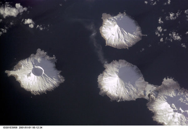 Island with a prominent caldera in left (west) of image is Herbert, just northeast of it is Carlisle, and Mount Cleveland lies almost directly east.  The western flanks of Tana are visible in the lower right of the image.

Mission: ISS001 Roll: E Frame: 5958 Mission ID on the Film or image: ISS01
Country or Geographic Name: USA-ALASKA
Features: MT. CLEVELAND, SMOKE
Center Point Latitude: 53.0 Center Point Longitude: -170.0