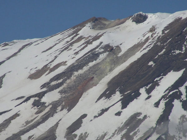 Photo of a fumarole located on the western flank of Mt. Griggs. The alteration material and sulfurous deposits can be observed.
