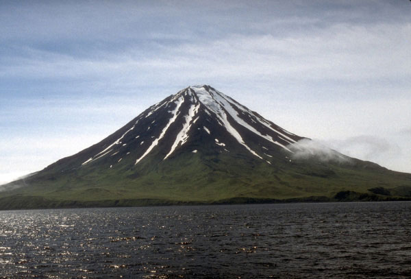 View of steep-sided, symmetrical Carlisle volcano on Carlisle Island in the central Aleutian Islands. The 1,620-m (5,315 ft)-high stratovolcano has erupted several times since the late 1700's. Alaska Fairbanks, July 24, 1994.