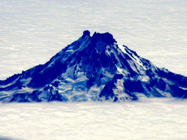 The north side of Isanotski Volcano as seen from a plane. The image was re-exposed in order to decrease the glare and haze in the image.