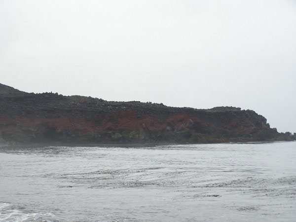 Zoomed in photo taken from the beach to the south side of the newly formed volcaniclastic debris flow fan deposit of a young, undated, lava flow on the southwestern flank of Mt. Cleveland.