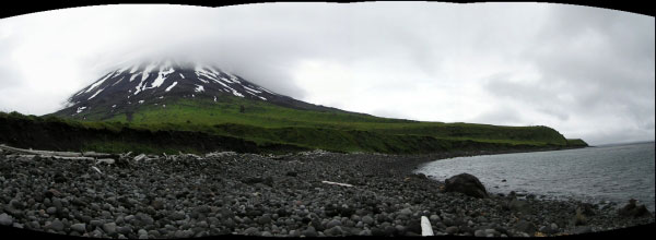 Panoramic photo of the northeastern flank of Mt. Cleveland taken from a cobble beach just west of Applegate Cove. The large lava flow that extends from the summit region to the coast, and right side of the photo that has a line of large rocks on the top of it, was playfully named "Mohawk Flow."