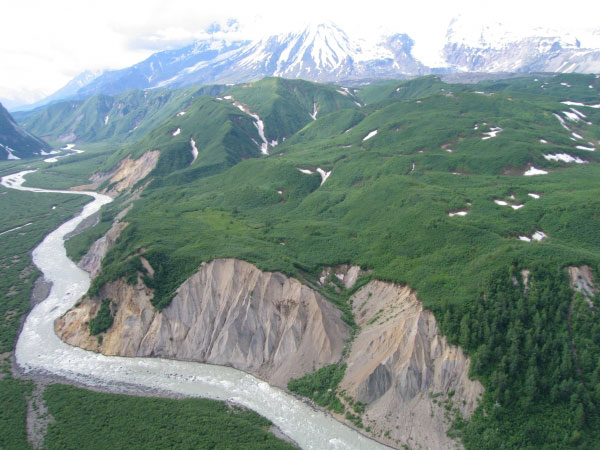 Looking NW at Chakachatna River cutting into Spurr debris-avalanche deposit, with Crater Peak in the background.
