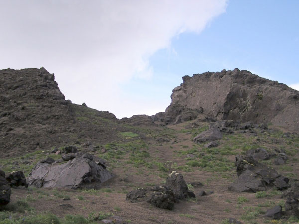 A slot in the central part of the southeasternmost lava dome on the flanks of Mount Cleveland. The view is from the northern part of the dome. The photo was enhanced to bring out the contrast.