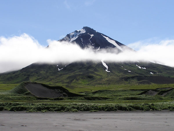 A view from the beach at Applegate Cove of the older volcanic edifice that dominates the eastern half of Chuginadak Island.