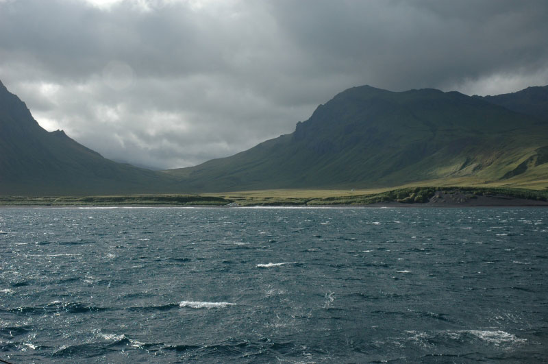 View westward from the East Bight anchorage at Semisopochnoi Island.  This unnamed valley heads at the caldera rim.  Ragged Top out of photo to left.  This beach was the staging area for seismic installation and geolgic work in 2005.  The Maritime Maid spent three nights anchored here.  