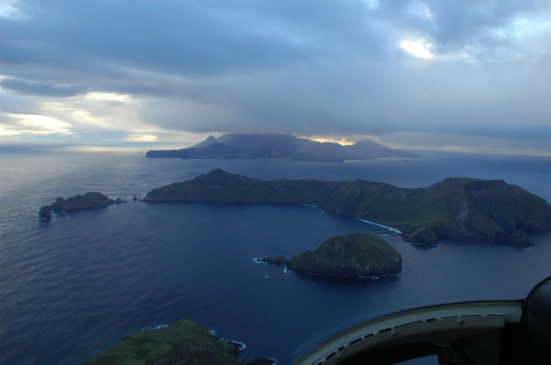 Davidof Volcano.  Small islets are Lopy Island (l) and Pyramid Island (r).  Little Sitkin on horizon.