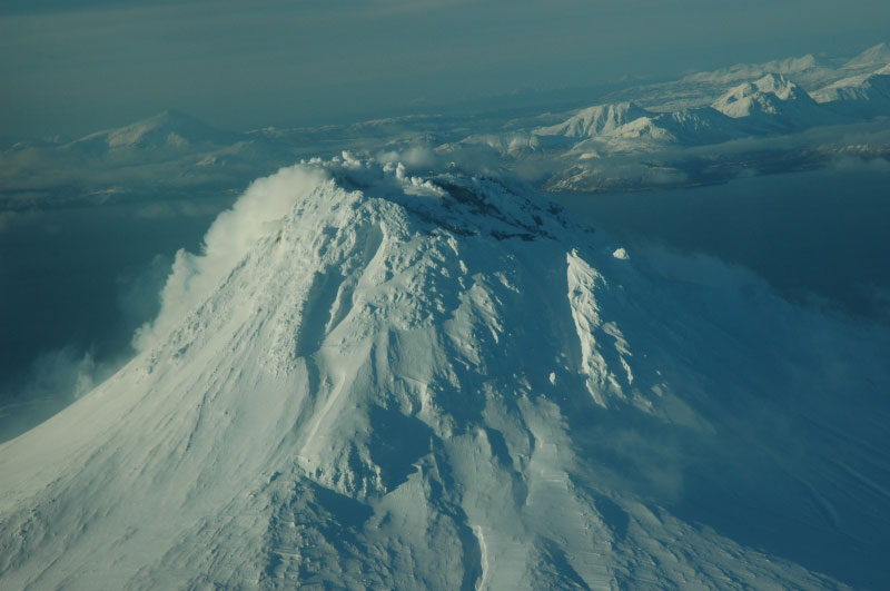 Augustine summit fumaroles, and gas plume driven down south flank.