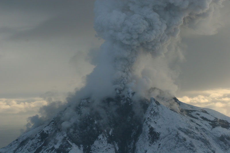 Augustine Volcano emitting steam and ash.