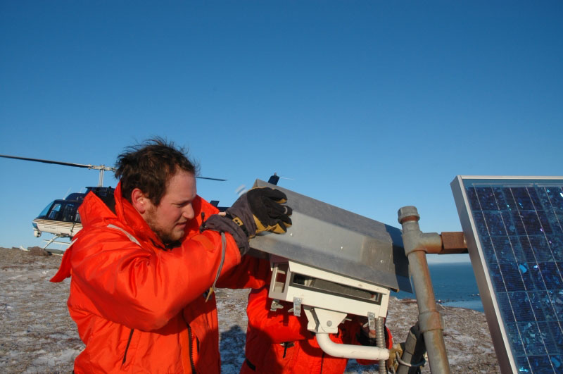 Cyrus Read replaces lid to camera housing.