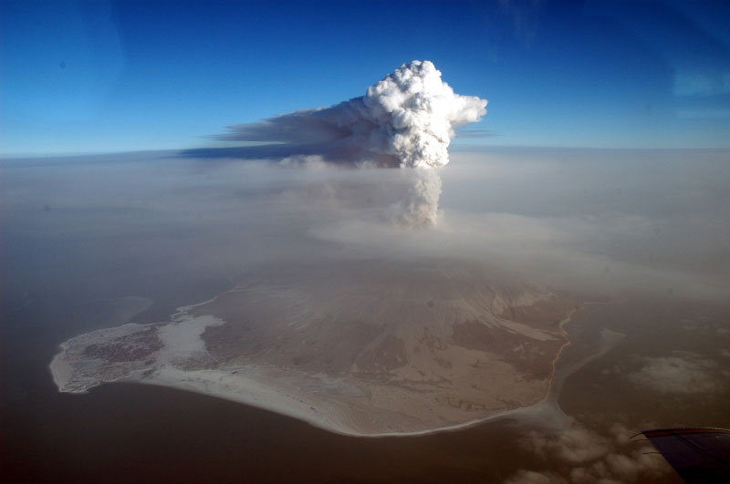 Steam plume with minor ash extending northeastward from Augustine volcano.  View from southwest.