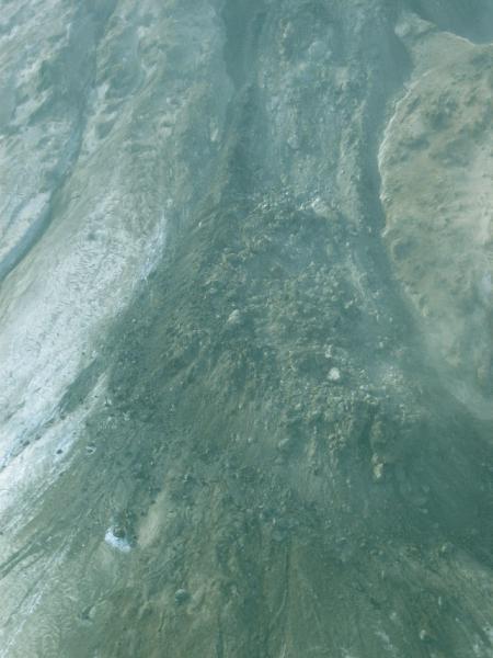 View of the northeast lava flow.  Note the levees middle way up front the flow front.  The toe of the flow was continued to descend the slope, thinning the middle part of the flow.