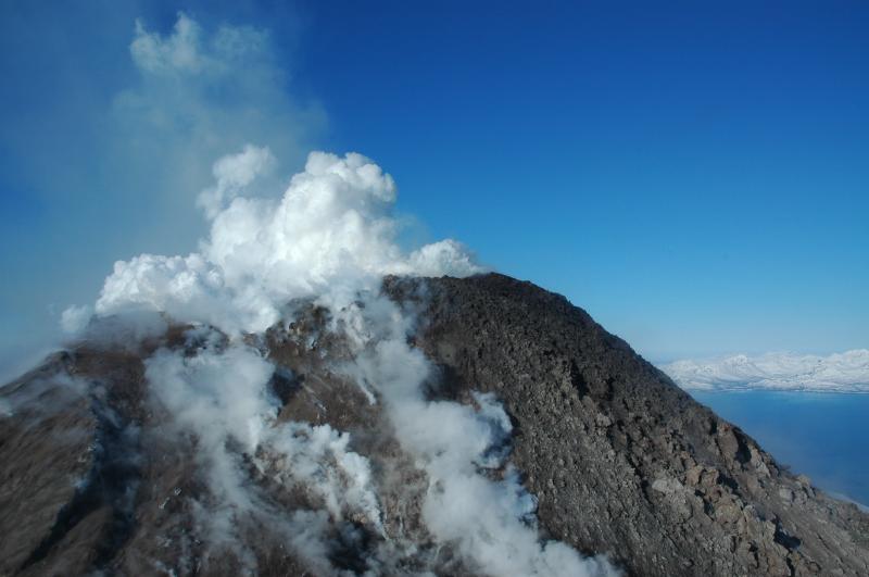 Augustine's lava dome, growing out of the north half of the summit crater. The south half of the crater is filled with stemaing rubble and pyroclastic material.