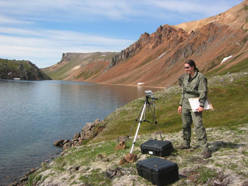 Geologist Jennifer Adleman uses a radiometer inside the caldera of Black Peak on the Alaska Peninsula.