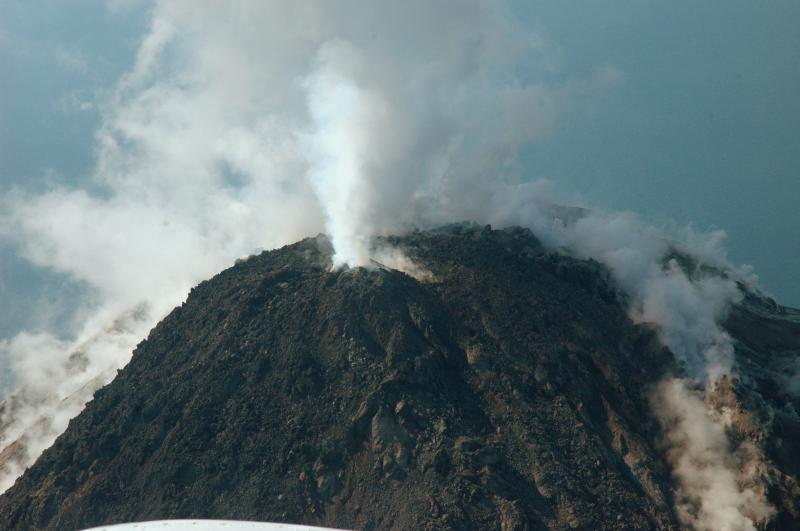 Upper north flank and summit lava dome.  Fumarole at top of dome in foreground is the source of most of the SO2 emissions.