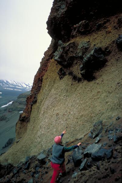 Geologists examines pumice and bombs in west wall of Half Cone in Aniakchak caldera