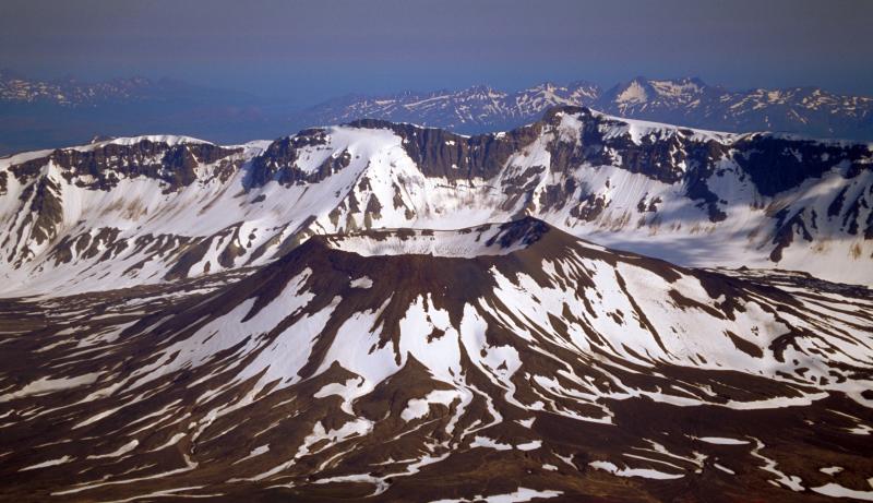 Aerial view of Aniakchak caldera. Vent Mtn., with Aniakchak Peak on rim in background.