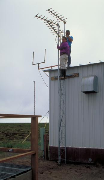 Installing antenna at Port Heiden receiving station for the Aniakchak caldera seismic network 