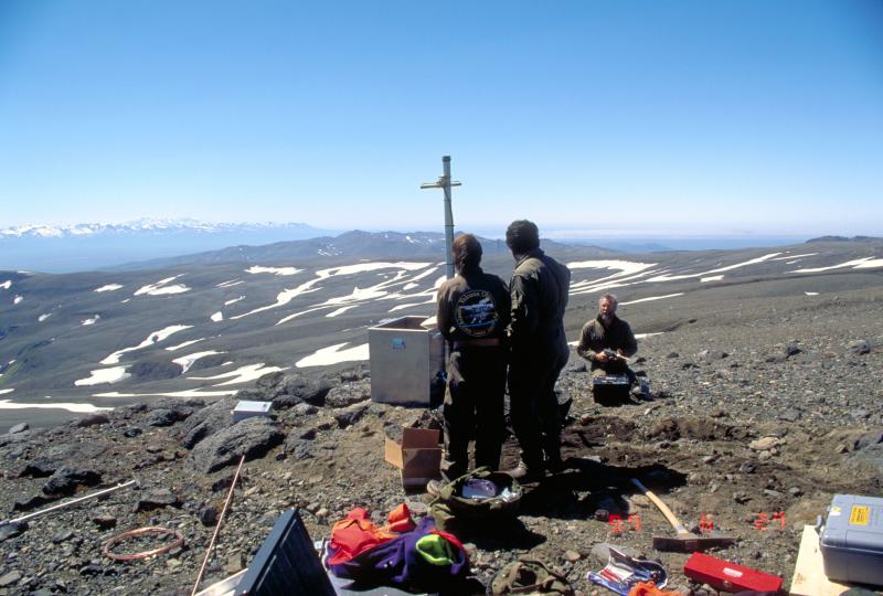 Installation of Aniakchak seismic station (Aniakchak Peak), Veniaminof on distant skyline. 