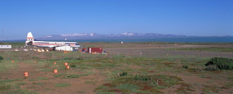 Reeve Electra at Port Heiden, AK airfield, rim of Aniakchak caldera on distant skyline