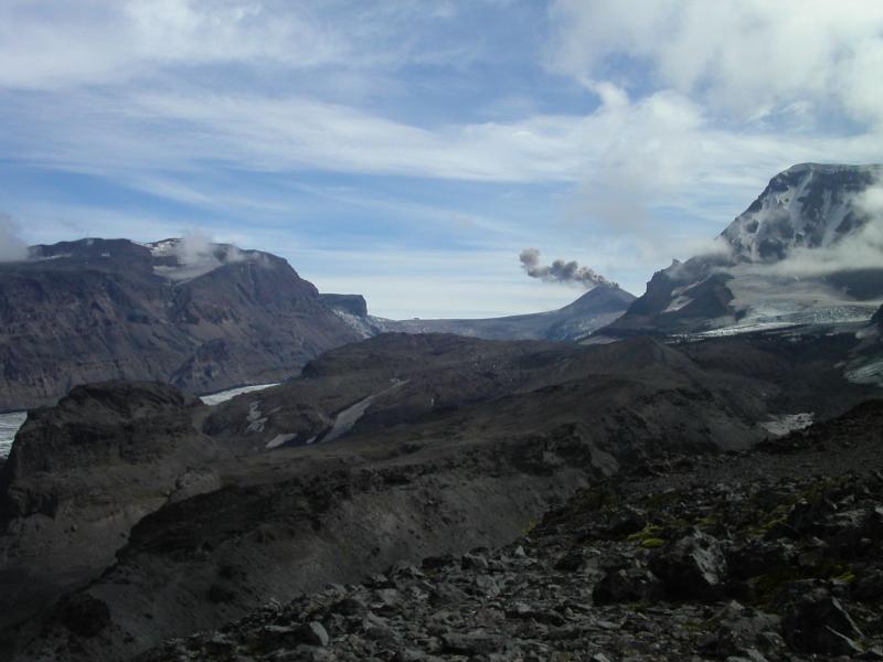 View up valley of Cone Glacier toward active cone, August 2004, taken while mapping geology of flank lavas.  Mild activity at cone consisted of occasional steam explosions that carried a little ash.