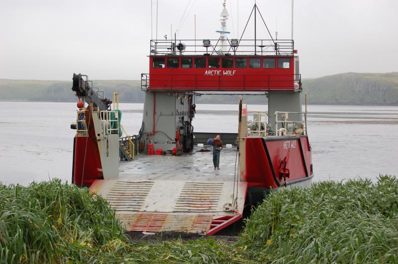 John Paskievitch disembarks the 136' landing craft M/V Arctic Wolf in Constantine Habor, Amchitka.