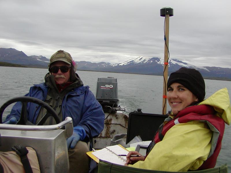 Painter Creek Lodge owner, Jon Kent, and USGS geologist, Kristi Wallace, conduct a bathymetric survey of Mother Goose Lake.  The lower flanks of Chiginagak volcano can be seen in the background towards the southeast.