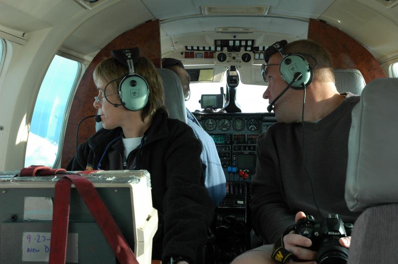 AVO volcanologists Tina Neal and Peter Cervelli making observations during an overflight of Fourpeaked volcano.