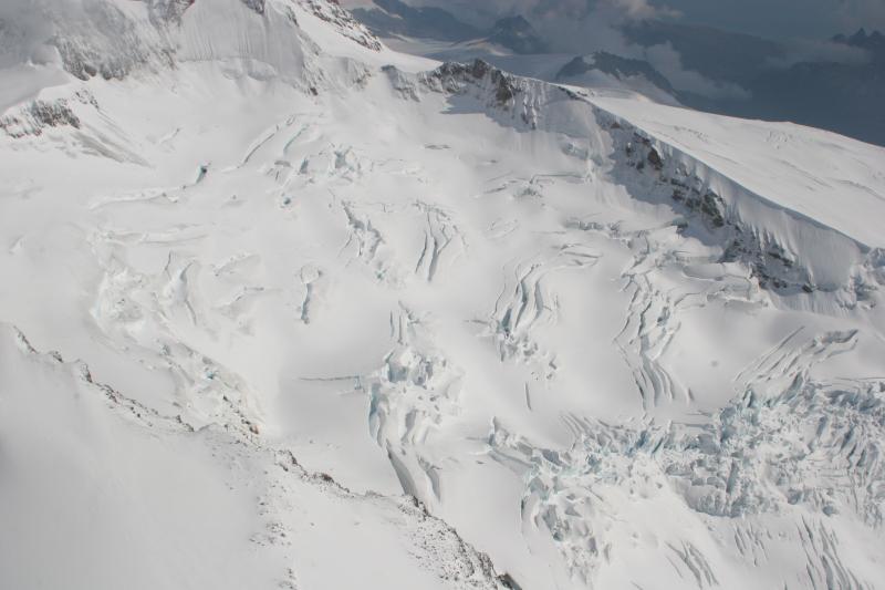 South-facing summit area on Fourpeaked volcano.  No obvious signs of disturbance in the ice from the September 17, 2006 event.   View is looking from the west to the east.