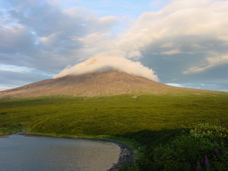Augustine Field work, August, 2006. Summit clouds and plume in late setting sun, from camp.