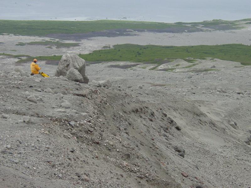 Augustine Field work, August, 2006. Dr. Jim Beget (AVO-UAF) taking notes next to block in '06 "Windy" CBpf.