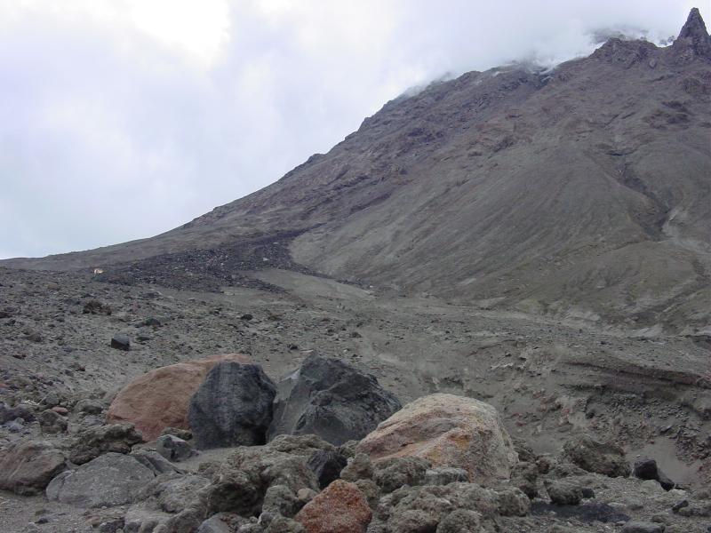 Augustine Field work, August, 2006. Block-and-ash flow (Aba; black lobes), East chute. The Pinnacles are in upper righthand corner of photo.