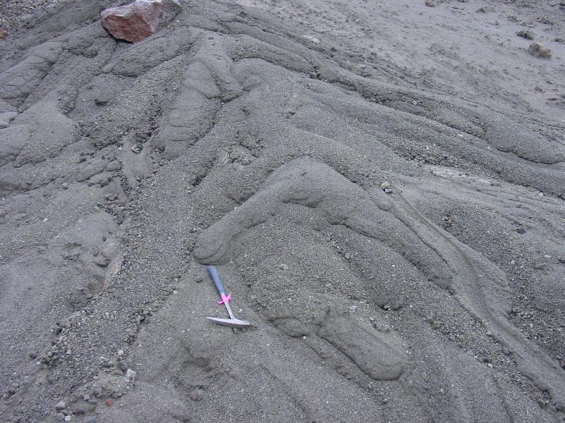 Augustine Field work, August, 2006. Mini lahars, showing perfect lobe morphologies, levees and other lahar textures. Hammer is ~40 cm long.