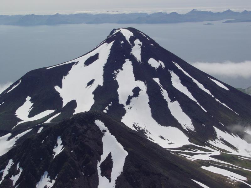 Sarichef volcano on northern Atka Island.  Glaciated, eroded flanks suggest that this volcano has not been active in recent history, but may have had activity within the Holocene. 
