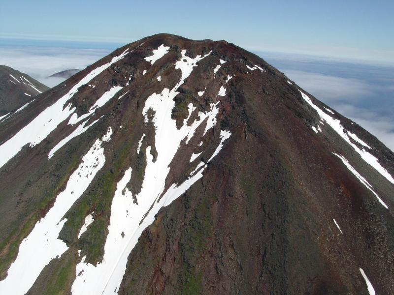 Sarichef volcano on northern Atka Island.  Glaciated, eroded flanks suggest that this volcano has not been active in recent history, but may have had activity within the Holocene. 