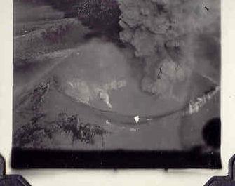 Images of Veniaminof erupting in either 1942, 1943, or 1944, taken by Lawrence Tyree while he was stationed with the US Army, commanding a battery unit in Cold Bay. He described the eruption to his granddaughter, Hester McEuen: As far away as it was from the battery it shed a light over the battery - the light from it cast a shadow.  You could see chunks of lava being tossed finto the air and falling back, it was quite spectacular.  The whole time I was there, it looked like an old man lying on his back blowing puffs of smoke rings. The eruption of Veniaminof was to a degree amusing.  When it erupted the light was so bright the guard on duty came to my quarters and knocked on the door.  It was after midnight.  He said &quot;Sir you ought to get out here and see this.&quot;  Our quarters were underground.  As we walked up the steps he said &quot;Sir I didn&#039;t mean for that to sound like a command but you need to get out here and see this.&quot; The other thing that occurred was an earthquake that shook the area pretty good.  I ended up on the floor, falling out of my bunk.  One of the other guys and I sat there looking at each other from the floor.  It knocked the guard on duty to the ground, that first initial shake.  There were no aftershocks that I recall.