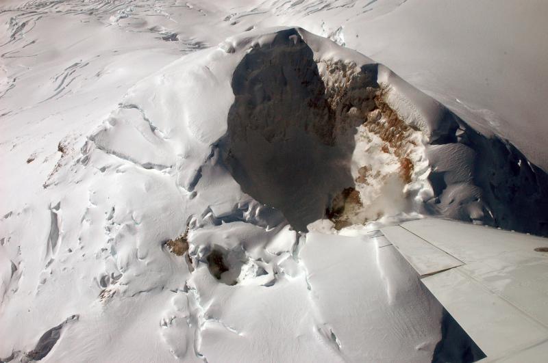 View down into the ice cauldron of Mount Spurr, which is accumulating snow except for the area with active fumaroles.