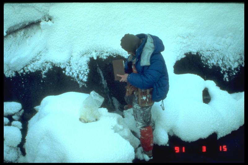 Terry Keith collecting water samples from mid-valley thermal springs, Valley of Ten Thousand Smokes, Katmai.